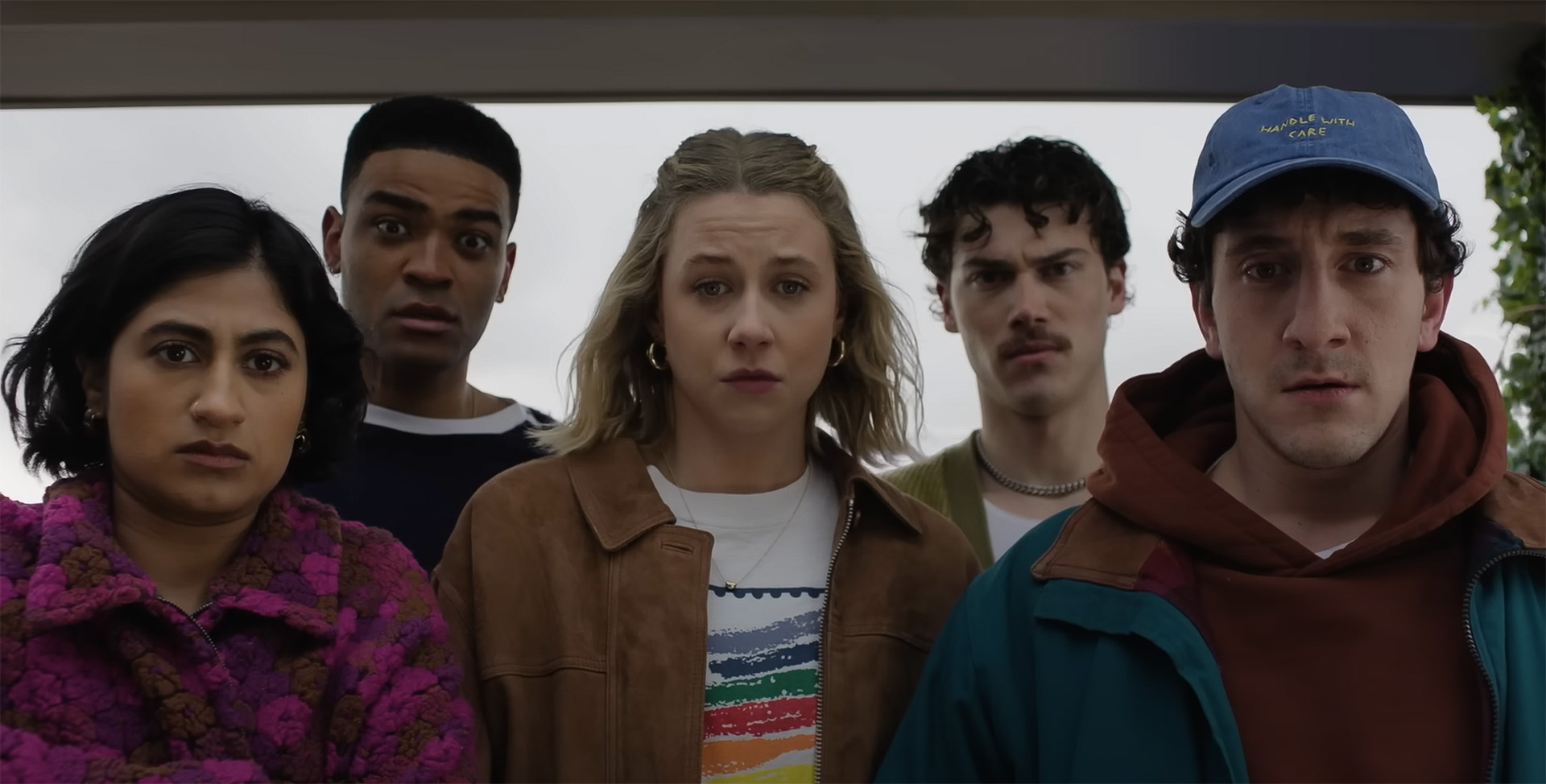 he main cast of Adults poses together, smiling, showcasing their diverse characters and vibrant personalities.